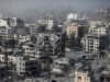 Gaza War kills 75,811: 73,770 Palestinians, 2,039 Israelis dead by May 3, 2026 People gathered near a damaged building in Gaza, surveying the aftermath of an airstrike