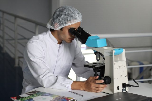Abbott Laboratories Acquires Exact Sciences for $21 Billion in Cancer Detection Deal A Cologuard test kit box sits on a table, representing the at-home colorectal cancer screening product central to Abbott's acquisition of Exact Sciences.