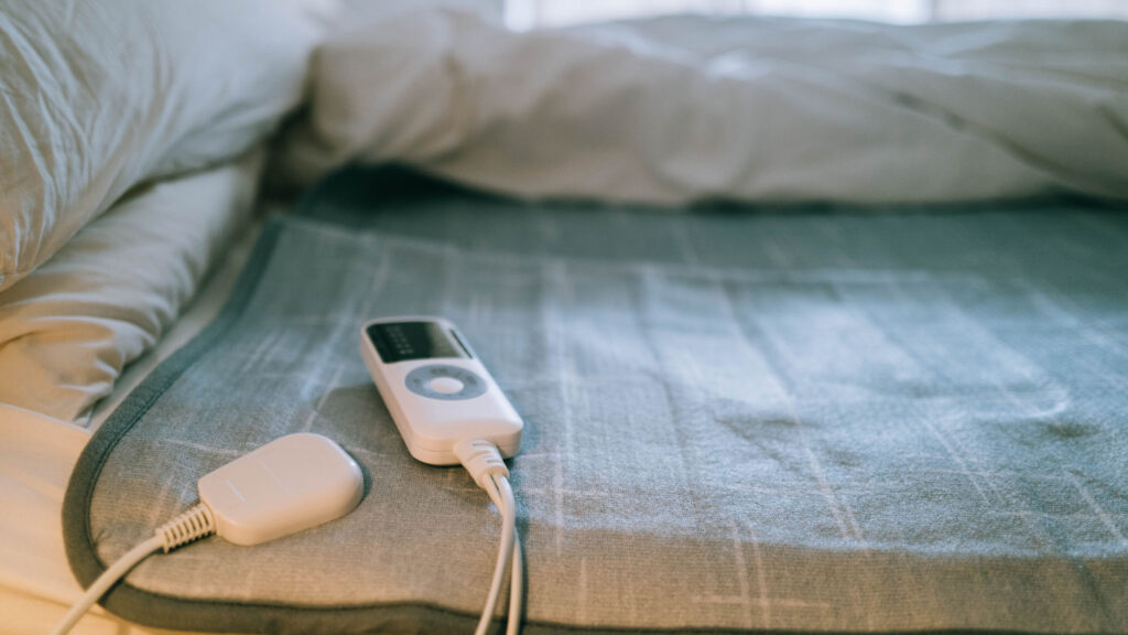 Electric Heated Blanket On A Bed
