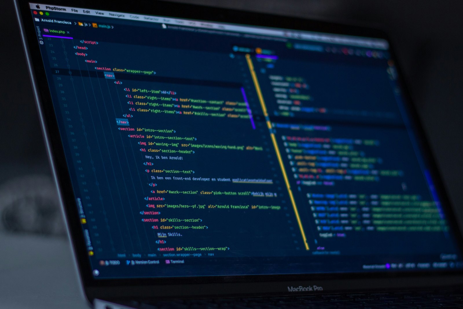 turned-on MacBook Pro wit programming codes display
