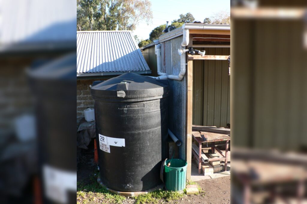 Rain Barrel On A Rooftop